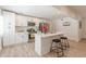 Beautiful kitchen with stainless steel appliances, an island with barstool seating, and white cabinets at 2649 Santa Barbara Nw Dr, Atlanta, GA 30318