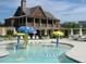 Community pool with mushroom water features and lounge chairs at 3645 Canopy Chase, Cumming, GA 30041