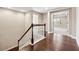 Upstairs hall with hardwood floors and white railing at 3645 Canopy Chase, Cumming, GA 30041