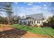 A well-maintained backyard featuring a patio with seating and a lush, green lawn, great for outdoor enjoyment at 535 Cape Ivey Dr, Dacula, GA 30019