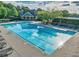 The inviting community pool features clear blue water, lounge chairs, and a clubhouse for residents' leisure at 535 Cape Ivey Dr, Dacula, GA 30019