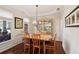Formal dining room featuring natural light, and elegant decor, perfect for entertaining guests at 535 Cape Ivey Dr, Dacula, GA 30019