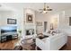 Spacious living room with a fireplace, hardwood floors, and open layout, perfect for Gathering gatherings at 535 Cape Ivey Dr, Dacula, GA 30019