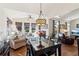 Bright sunroom with large windows, hardwood floors, and comfortable seating offers a relaxing space at 535 Cape Ivey Dr, Dacula, GA 30019