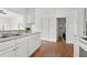 View of kitchen with white cabinets and hardwood floors at 2070 Ridgedale Ne Rd, Atlanta, GA 30317