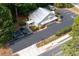 Aerial view showcasing ample parking, thoughtful landscaping, and the building's overall layout within its setting at 4205 Jim Owens Nw Rd, Kennesaw, GA 30152