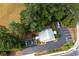 Property with ample parking and surrounding trees at 4205 Jim Owens Nw Rd, Kennesaw, GA 30152