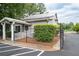 Rear view of building with fenced area and landscaping at 4205 Jim Owens Nw Rd, Kennesaw, GA 30152