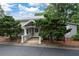 View of building entrance, showing covered porch and landscaping at 4205 Jim Owens Nw Rd, Kennesaw, GA 30152