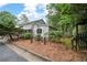 Landscaped yard with mature trees and decorative accents at 4205 Jim Owens Nw Rd, Kennesaw, GA 30152
