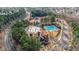 Aerial view of community pool, tennis courts, and clubhouse at 724 Landsdowne Ln, Locust Grove, GA 30248