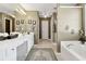 Double vanity bathroom with soaking tub and walk-in shower at 724 Landsdowne Ln, Locust Grove, GA 30248