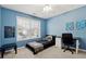 Light blue bedroom with a desk and twin bed at 724 Landsdowne Ln, Locust Grove, GA 30248