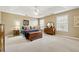 Spacious Primary bedroom with carpeted floor and ceiling fan at 724 Landsdowne Ln, Locust Grove, GA 30248
