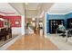 Two-story foyer with hardwood floors, red and blue walls, and views to dining and office areas at 724 Landsdowne Ln, Locust Grove, GA 30248