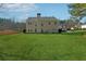 Two-story house with a large backyard and a patio at 724 Landsdowne Ln, Locust Grove, GA 30248