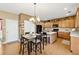 Bright kitchen with island, breakfast bar, and ample cabinetry at 724 Landsdowne Ln, Locust Grove, GA 30248