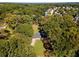 Aerial view of house with large backyard, surrounded by trees and other houses at 1352 Jennie Sw Ln, Lilburn, GA 30047