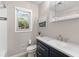 Updated bathroom with dark vanity and a modern faucet at 1352 Jennie Sw Ln, Lilburn, GA 30047