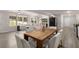 Open concept dining room with wood table and chairs, adjacent to the living area at 1352 Jennie Sw Ln, Lilburn, GA 30047
