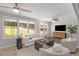 Bright living room with hardwood floors, comfortable seating, and large windows at 1352 Jennie Sw Ln, Lilburn, GA 30047