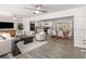 Open concept living space with hardwood floors, modern furniture, and kitchen views at 1352 Jennie Sw Ln, Lilburn, GA 30047