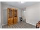 Bright office features wood shelving and vinyl plank flooring at 1352 Jennie Sw Ln, Lilburn, GA 30047
