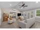 Bright sunroom addition with vaulted ceiling, windows, and comfortable furnishings at 1352 Jennie Sw Ln, Lilburn, GA 30047