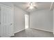 Spacious basement bedroom with neutral carpeting and ceiling fan at 1415 Eric Se St, Atlanta, GA 30315