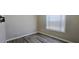 Simple bedroom with window and wood-look floors at 1432 Cutters Mill Dr, Lithonia, GA 30058