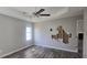 Primary bedroom with ceiling fan and needs minor repair at 1432 Cutters Mill Dr, Lithonia, GA 30058