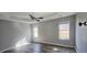Primary bedroom with ceiling fan and large windows at 1432 Cutters Mill Dr, Lithonia, GA 30058