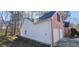 Side view of house with two-car garage at 1432 Cutters Mill Dr, Lithonia, GA 30058