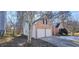 Two-car garage with side yard and trees at 1432 Cutters Mill Dr, Lithonia, GA 30058