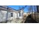 Rear of house with patio and wooden fence at 1432 Cutters Mill Dr, Lithonia, GA 30058
