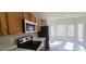 Kitchen with stainless steel appliances and breakfast nook at 1432 Cutters Mill Dr, Lithonia, GA 30058