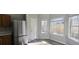 Eat-in kitchen with sunroom and stainless steel refrigerator at 1432 Cutters Mill Dr, Lithonia, GA 30058