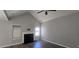 Living room with fireplace and vaulted ceiling at 1432 Cutters Mill Dr, Lithonia, GA 30058