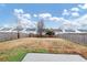 Fenced backyard with patio and open grass area at 2114 Black Oak Ln, Ellenwood, GA 30294
