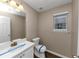 Clean bathroom with white vanity and updated fixtures at 2114 Black Oak Ln, Ellenwood, GA 30294