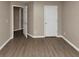 Spacious bedroom with wood-look floors and neutral walls at 2114 Black Oak Ln, Ellenwood, GA 30294