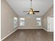 Spacious bedroom with vaulted ceiling and ceiling fan at 2114 Black Oak Ln, Ellenwood, GA 30294