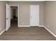 Spacious bedroom with wood-look floors and neutral walls at 2114 Black Oak Ln, Ellenwood, GA 30294
