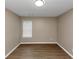 Spacious bedroom with wood-look floors and a window with blinds at 2114 Black Oak Ln, Ellenwood, GA 30294