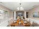 Formal dining room with hardwood floors and wood dining table at 2114 Black Oak Ln, Ellenwood, GA 30294