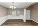 Dining room with hardwood floors, chair rail, and chandelier at 2114 Black Oak Ln, Ellenwood, GA 30294