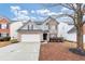 Two-story house with gray siding, brick accents, and a two-car garage at 2114 Black Oak Ln, Ellenwood, GA 30294