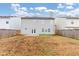 Two-story house with backyard and wooden fence at 2114 Black Oak Ln, Ellenwood, GA 30294
