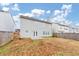 Two-story house with backyard and wooden fence at 2114 Black Oak Ln, Ellenwood, GA 30294