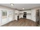 Kitchen with white cabinets, stainless steel appliances, and hardwood floors at 2114 Black Oak Ln, Ellenwood, GA 30294